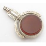 A Victorian silver pendant fob seal / pocket watch key, with central rotating bloodstone and