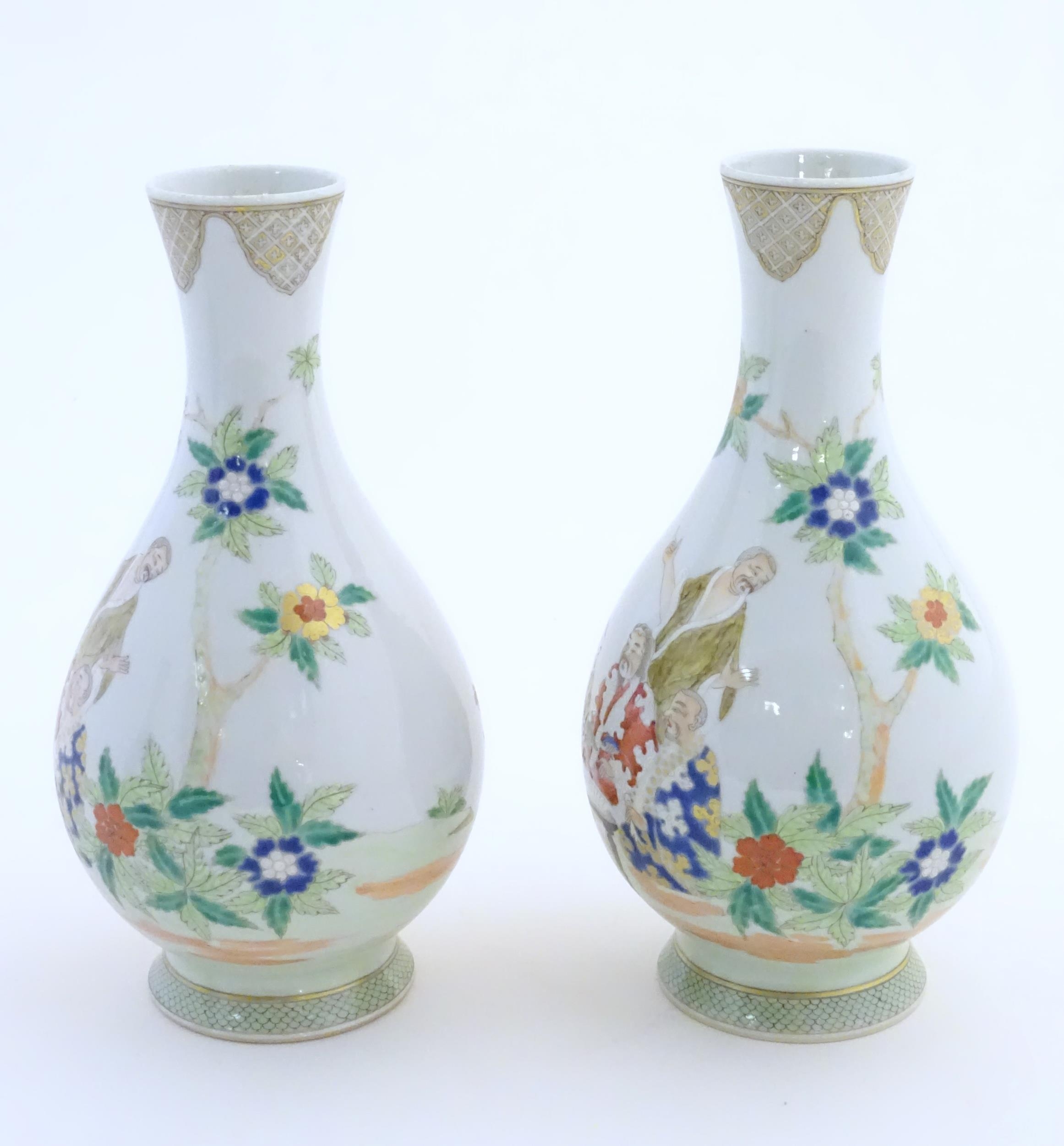 A pair of Chinese famille rose bottle vases decorated with seated figures on a garden terrace, - Image 4 of 6