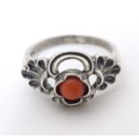 A Continental .800 white metal ring set with coral cabochon. Ring size approx. P Please Note - we do