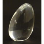 Baccaat glass: a clear glass pebble shaped paperweight with Baccarat makers mark to base. Approx 3