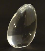 Baccaat glass: a clear glass pebble shaped paperweight with Baccarat makers mark to base. Approx 3