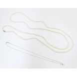 A silver pendant necklace, together with a pearl necklace. Pearl necklace approx. 46" long (2)