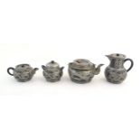 A quantity of Chinese yixing tea wares comprising teapot, coffee pot, sugar bowl and milk jug,