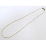 A seed pearl necklace. Approx. 14" long Please Note - we do not make reference to the condition of