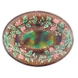 A majolica oval serving dish in the manner of Wedgwood with floral decoration. Approx. 11 1/4" x 14"