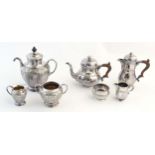 A three piece silver plate tea set comprising teapot, sugar bowl and cream jug, the teapot marked