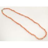 An early 20thC coral bead necklace. Approx. 16" long Please Note - we do not make reference to the