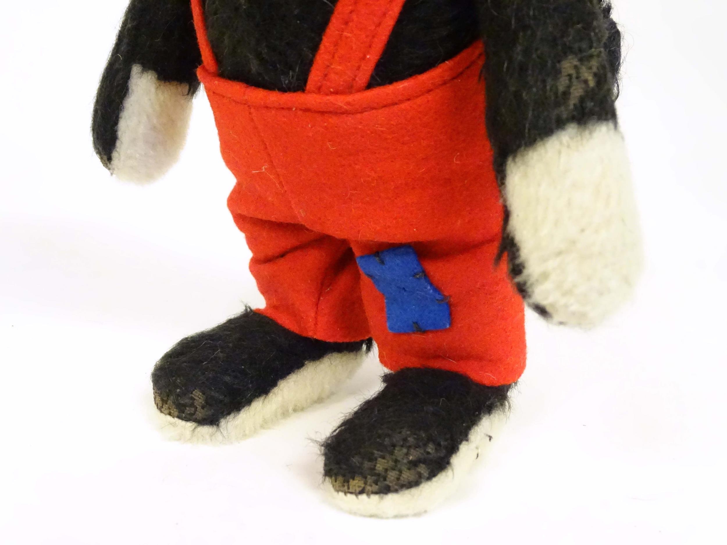 Toy: A mid 20thC Merrythought Mr Twisty stuffed toy dog, bearing label under. Approx. 11" high - Image 5 of 7