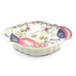 A Chinese export famille rose footed serving dish of lozenge form in the tobacco leaf pattern with