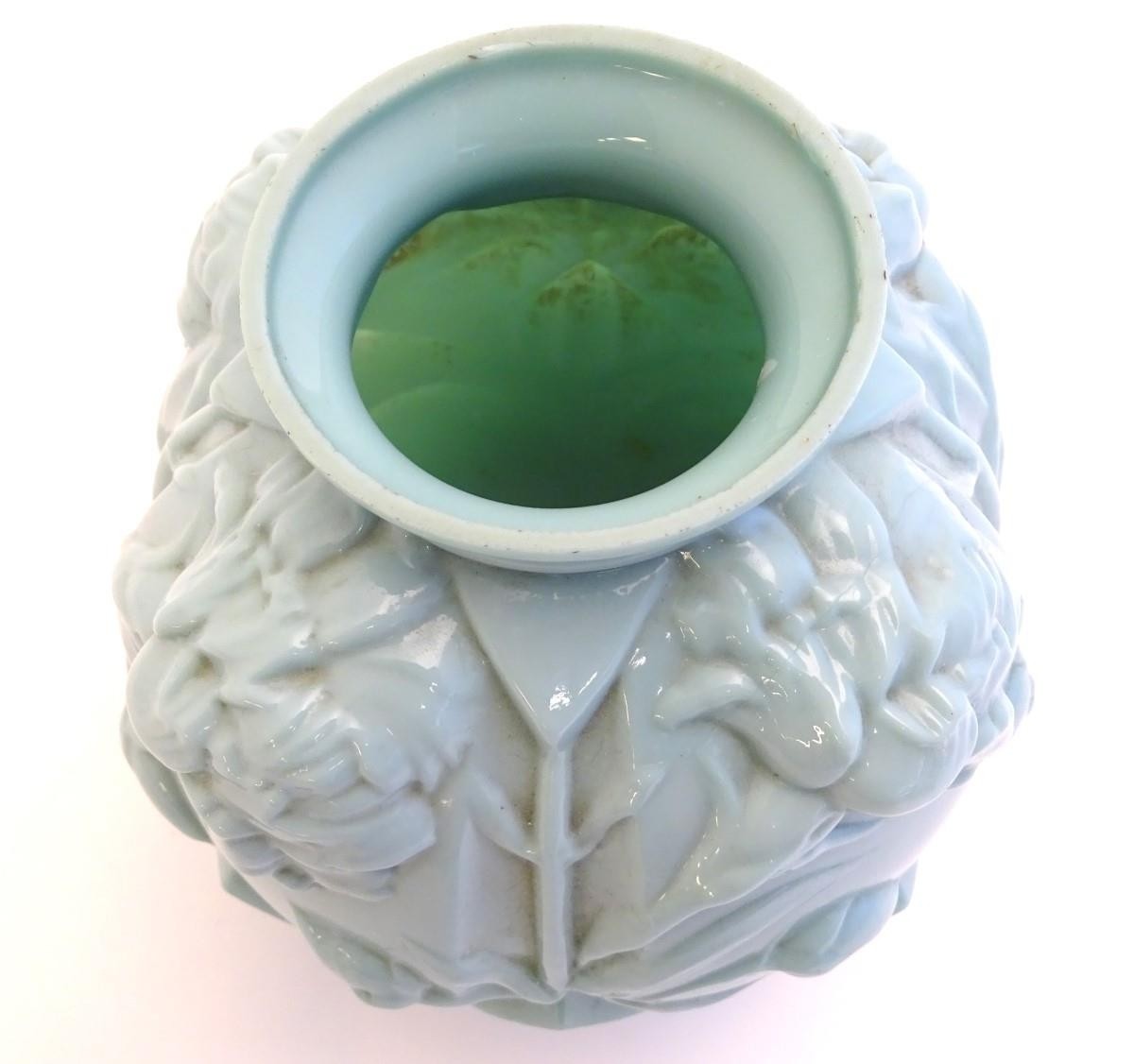 An Art Deco pale green glass vase with moulded floral decoration. 8'' high Please Note - we do not - Image 4 of 5