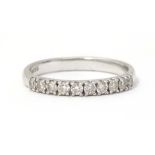 A 9ct white gold ring set with 10 diamonds in a linear setting . Ring size approx L. Please Note -