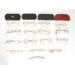 A quantity of late 19thC and later spectacles / glasses, comprising sixteen pairs. The largest 4 3/