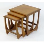 Vintage / Retro: A mid / late 20thC G plan red label nest of three tables with crossbanded tops. The