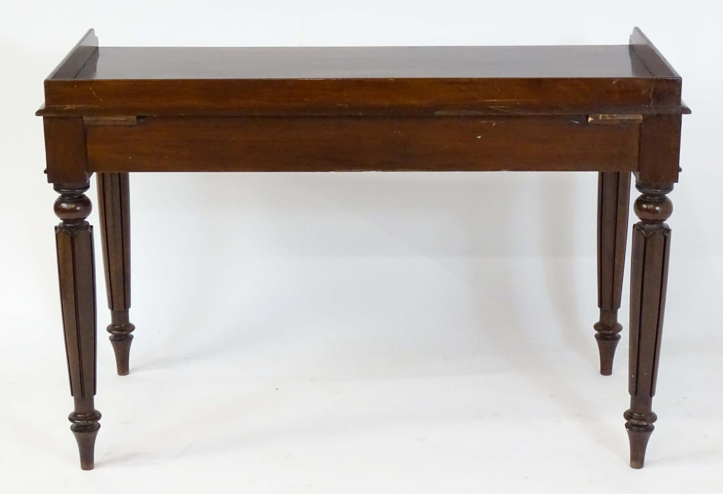 A Regency period mahogany dressing table with a shaped upstand above three shaped drawers and raised - Image 2 of 7