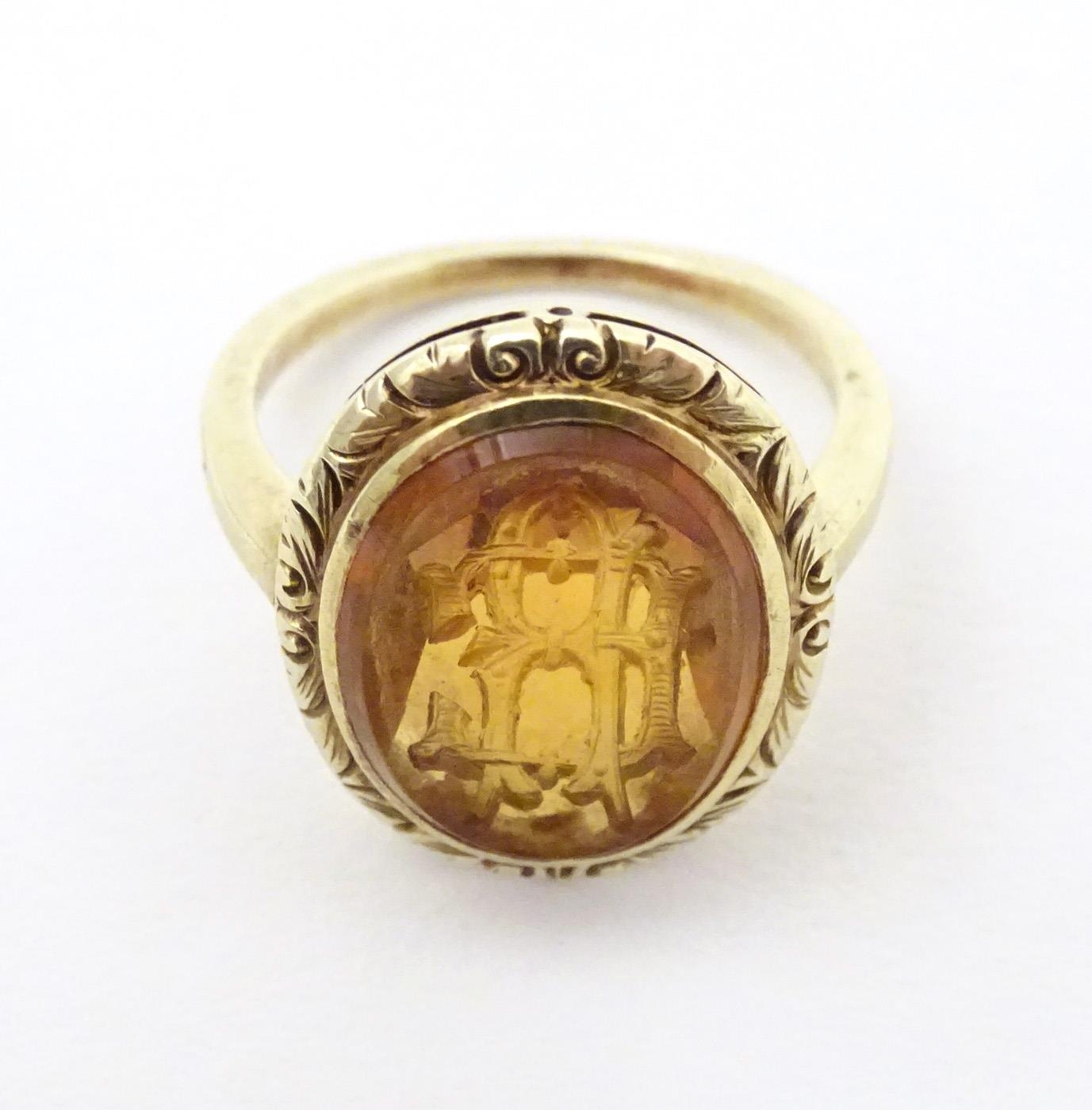 A late 19th / early 20thC yellow metal ring with engraved citrine seal to top depicting monogram. - Image 6 of 6