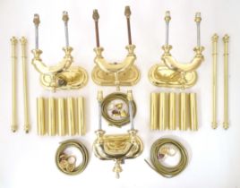 Four modern gilt wall lights by G-Lights, Barcelona, each with single branch supporting two lamps,
