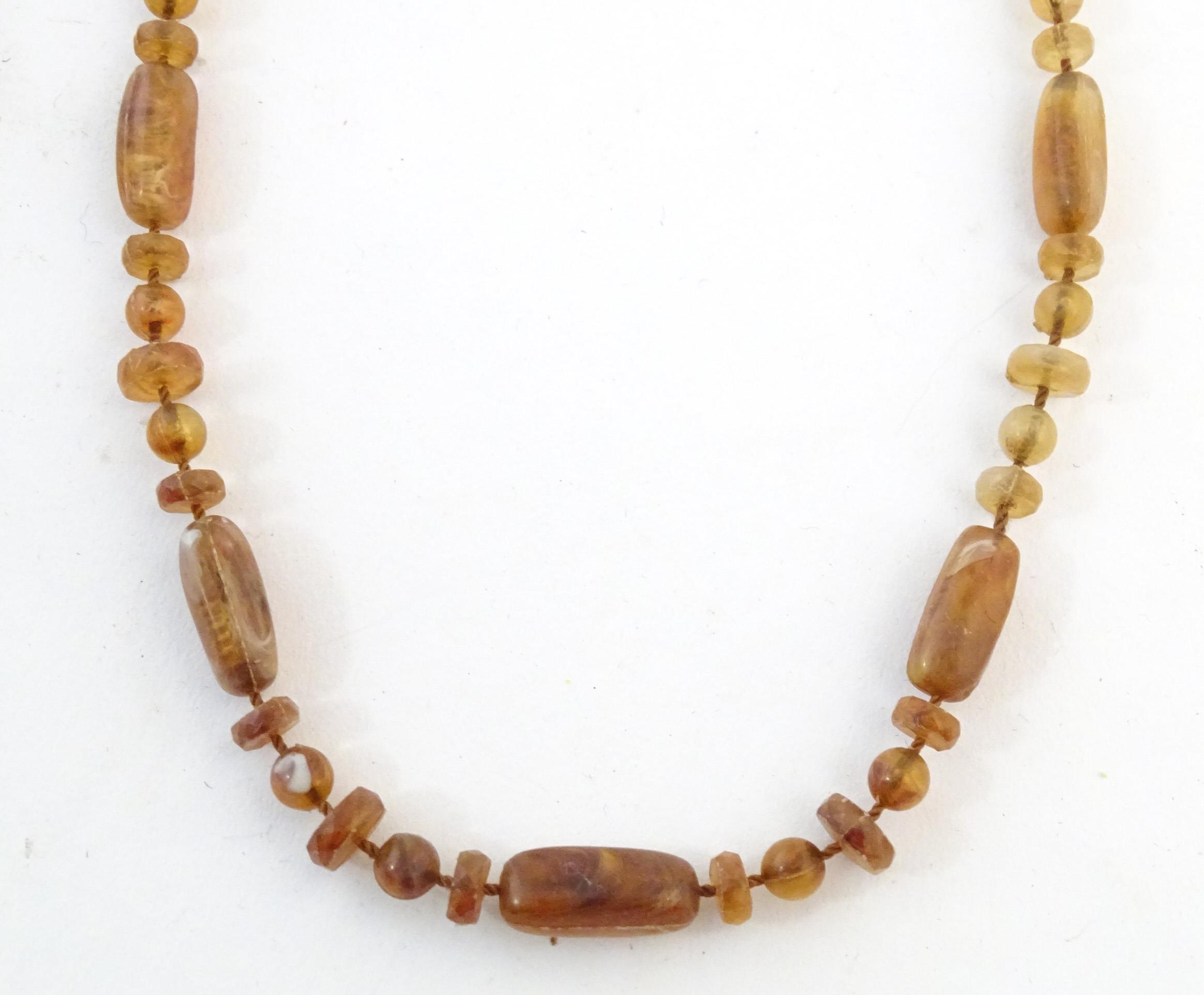 A quantity of assorted bead necklaces to include some amber examples. Please Note - we do not make - Bild 2 aus 16