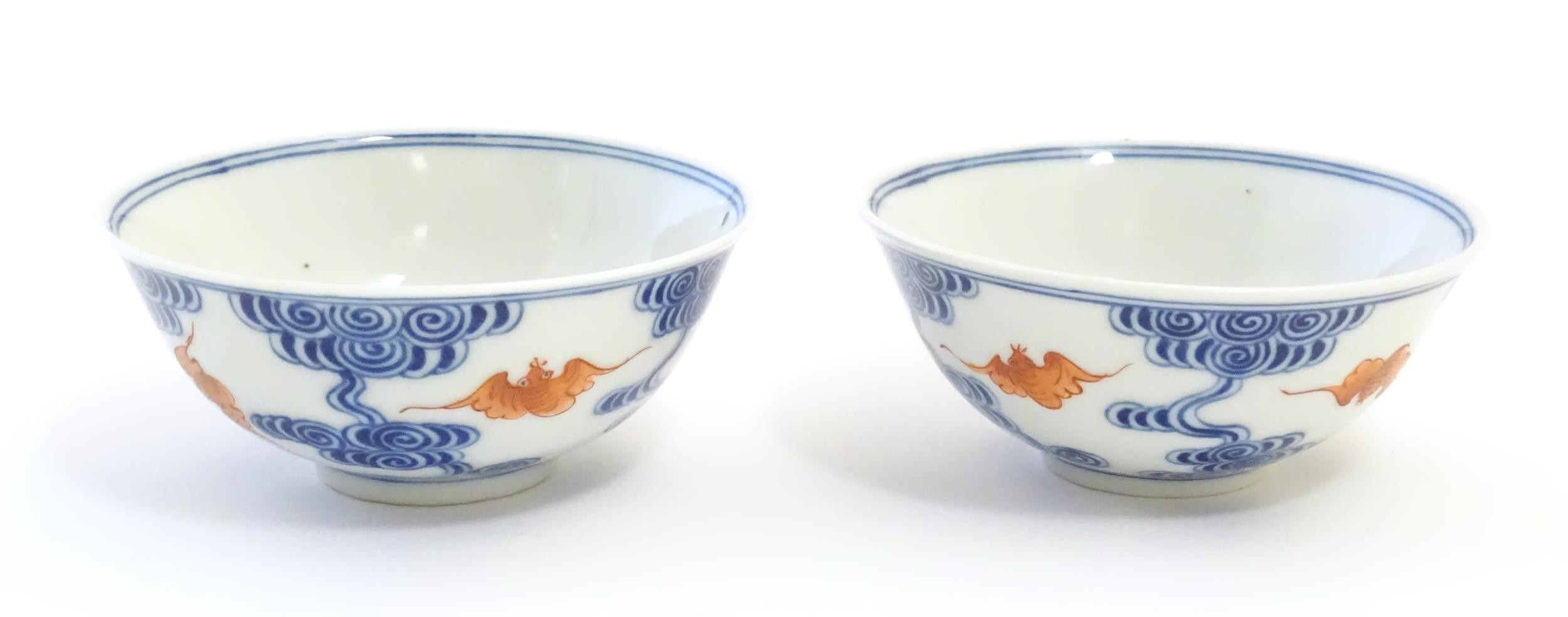 A pair of Chinese bowls decorated with stylised bats amongst clouds. Character marks under. - Bild 6 aus 9