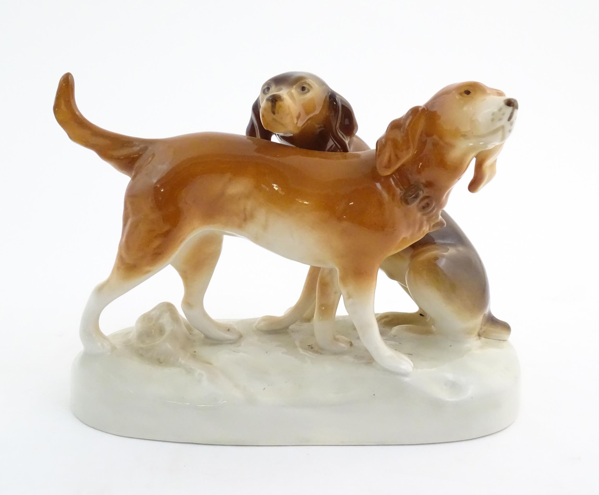 A 20thC Royal Dux model of two dogs. Marked under. Approx. 7 3/4" high x 11" wide (2) Please