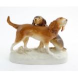 A 20thC Royal Dux model of two dogs. Marked under. Approx. 7 3/4" high x 11" wide (2) Please