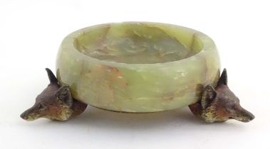 A 20thC green agate dish on an Austrian cold painted base with fox head detail. The stand marked