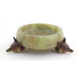 A 20thC green agate dish on an Austrian cold painted base with fox head detail. The stand marked