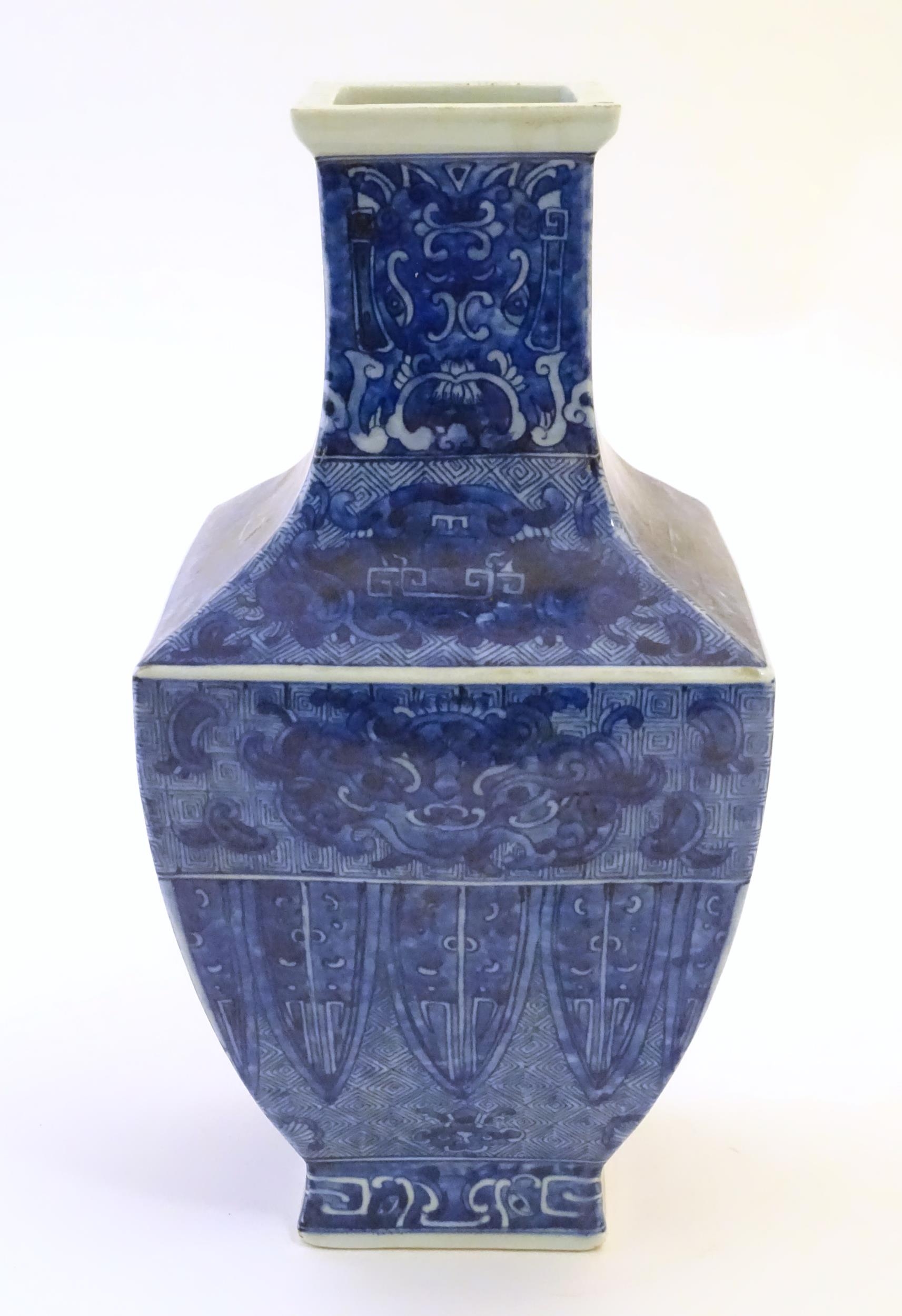 A Chinese blue and white vase of squared form decorated with stylised masks, banded detail and - Image 5 of 7
