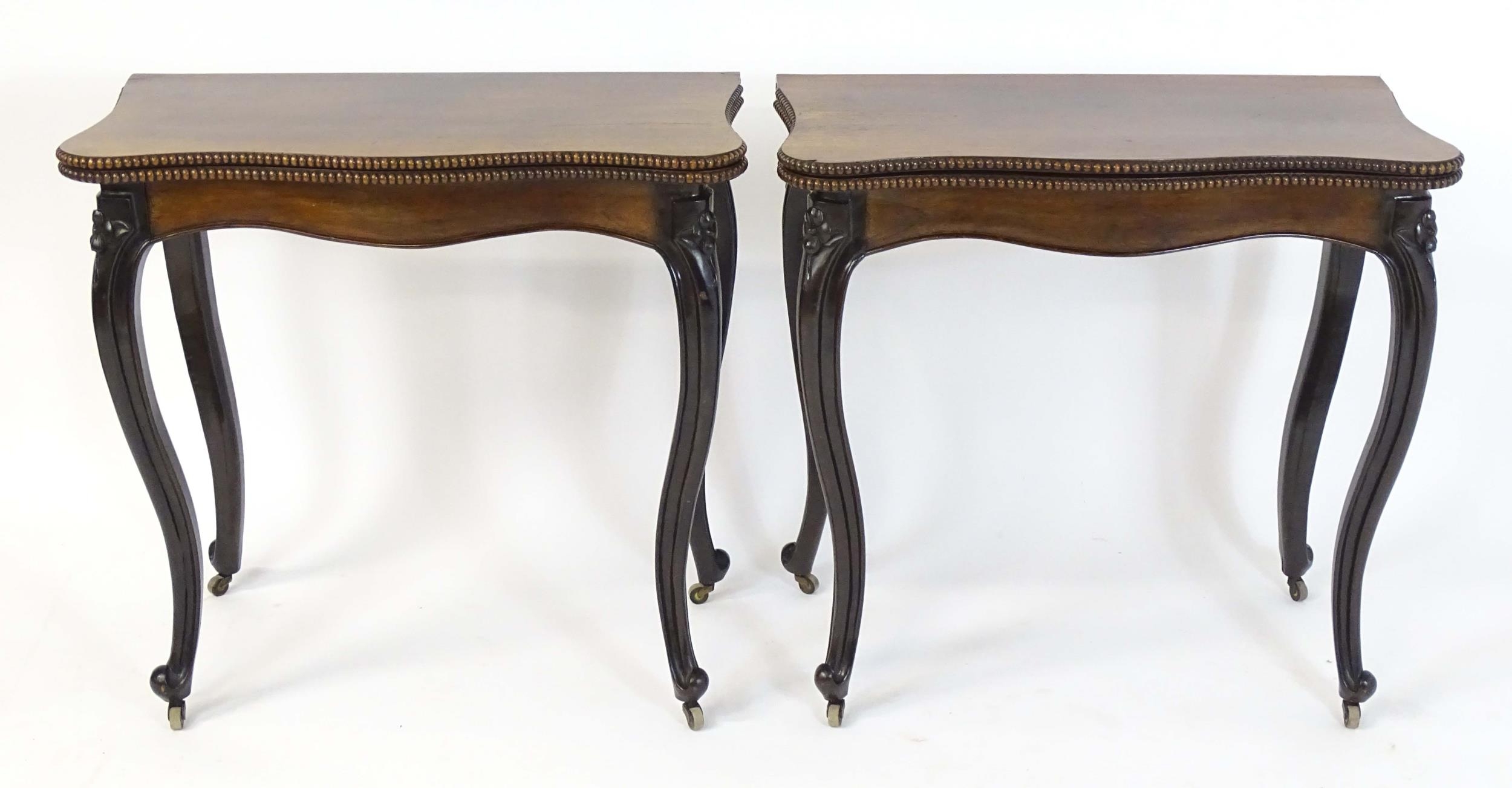 A pair of 19thC rosewood card tables of serpentine form, having beaded edges above floral carved - Image 8 of 18