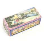 A Chinese famille rose paperweight decorated with a figures in a landscape scene, the sides with