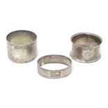 Three silver napkin rings comprising on hallmarked Birmingham 1939 maker John Rose, one Birmingham