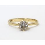 A 9ct gold ring set with white stone solitaire. Ring size approx. N Please Note - we do not make