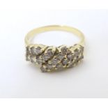 An 18ct gold dress ring set with 21 diamonds. Ring size approx P Please Note - we do not make