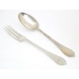 A silver christening fork and spoon with trefid handles hallmarked London 1911 maker Josiah Williams