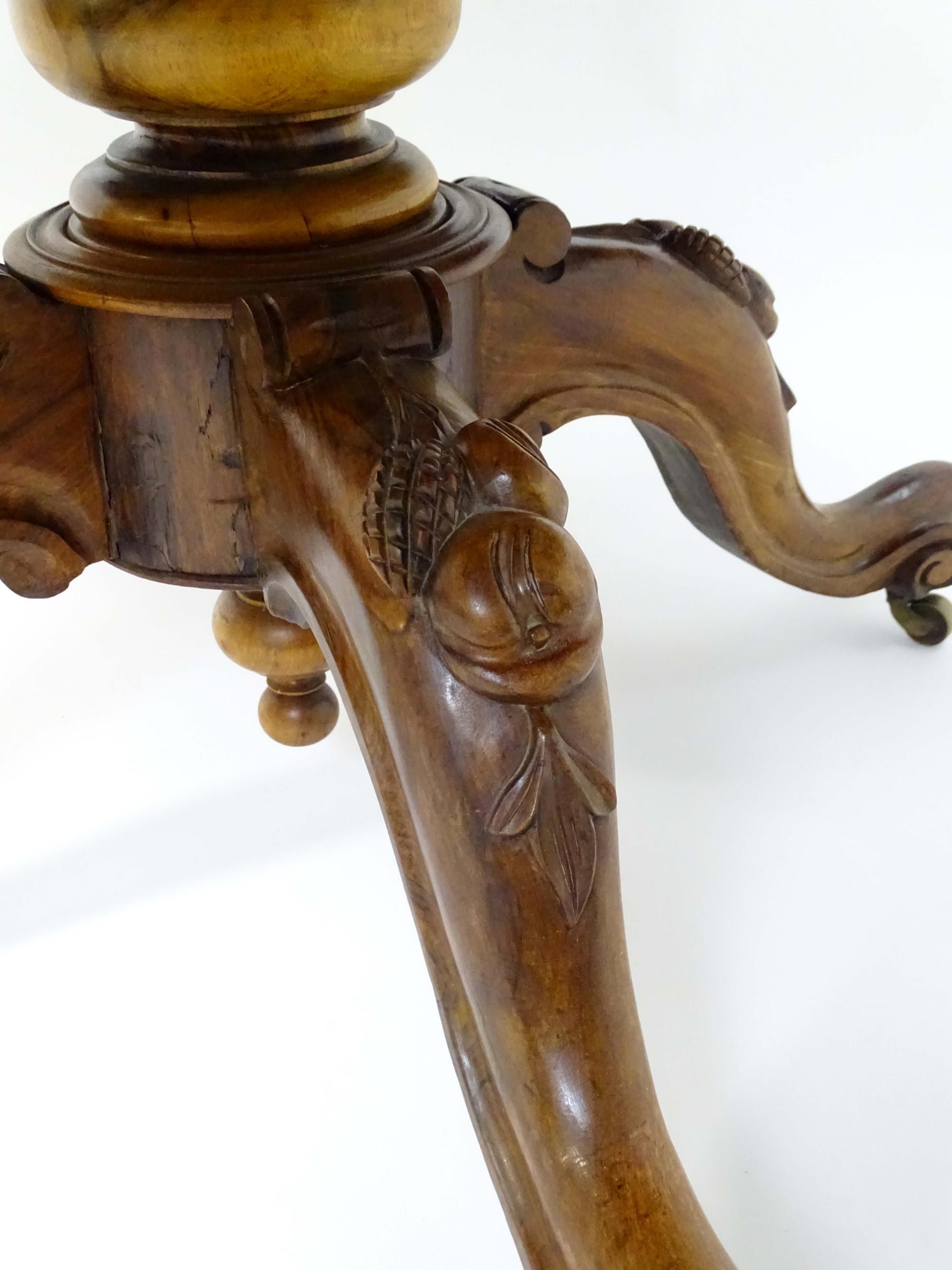 A mid 19thC walnut loo table with a burr walnut veneered top above a turned pedestal base and four - Image 4 of 12