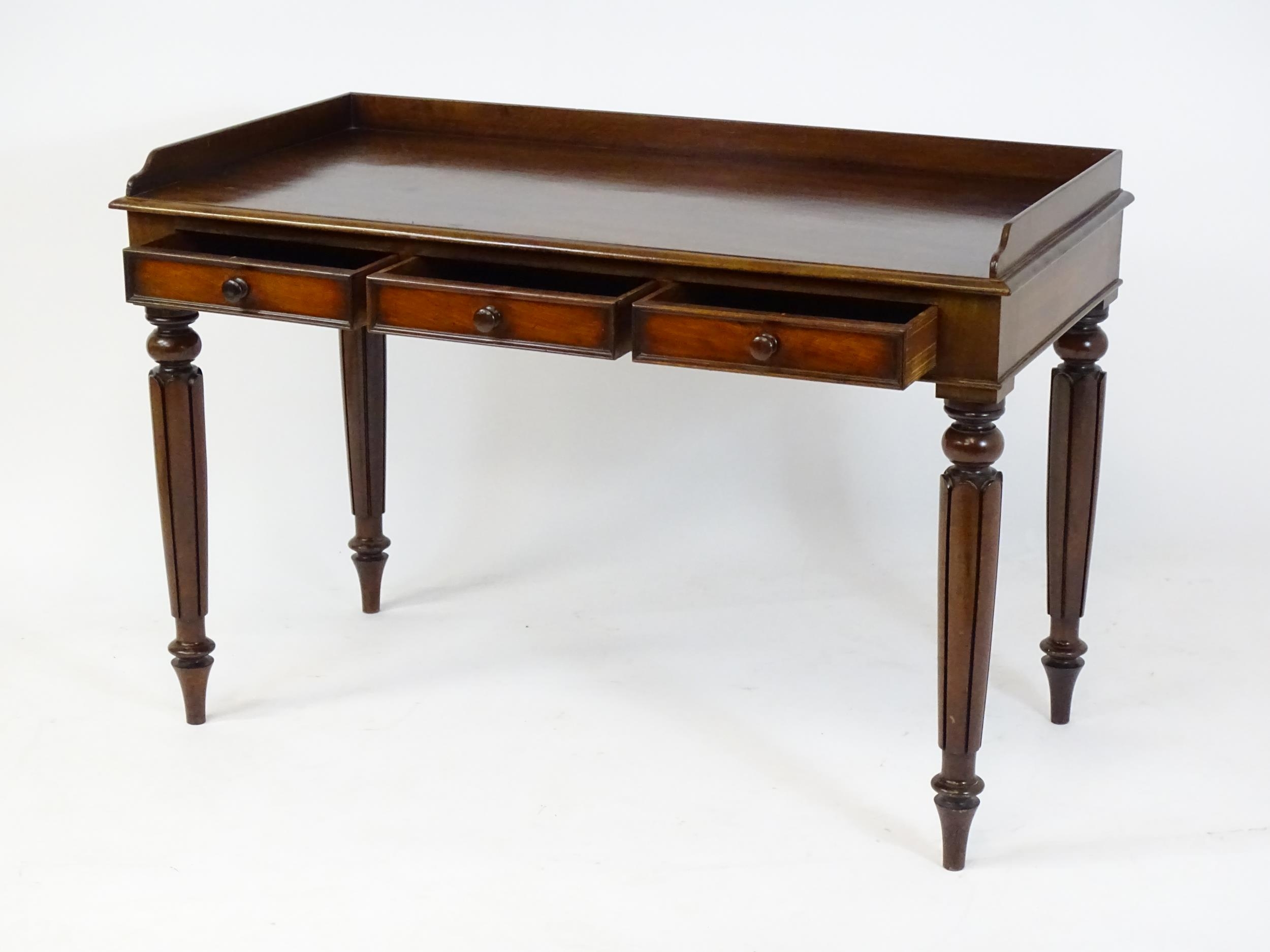 A Regency period mahogany dressing table with a shaped upstand above three shaped drawers and raised - Image 7 of 7