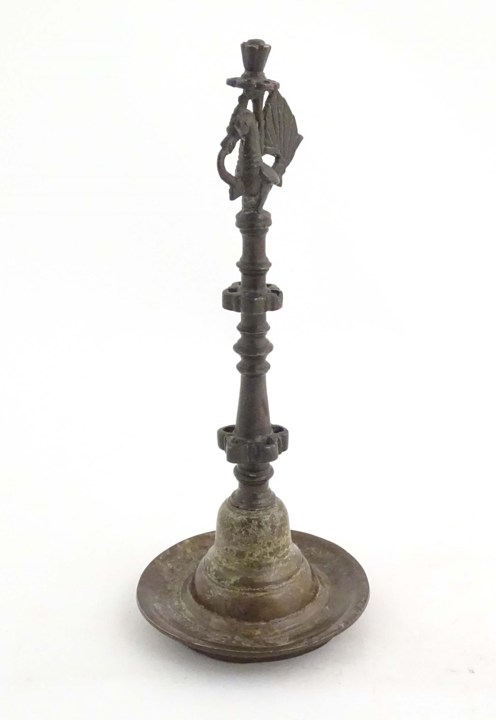 An Indian / Deccan cast temple style oil lamp with turned column surmounted by a Hamsa bird. Approx. - Image 4 of 8