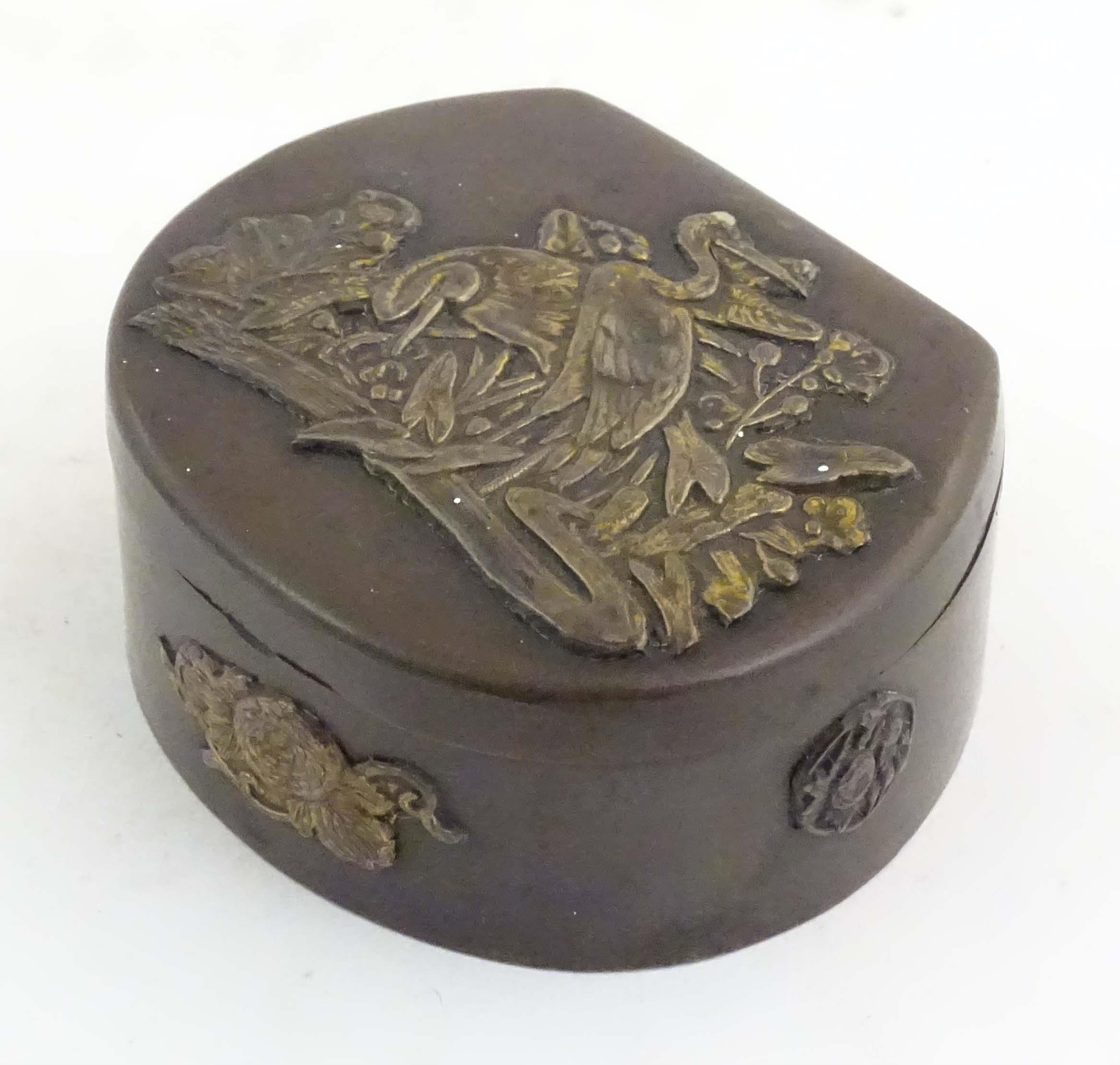 A Japanese lacquered brass stud box with a hinged lid, decorated with applied crane bird and - Image 4 of 8