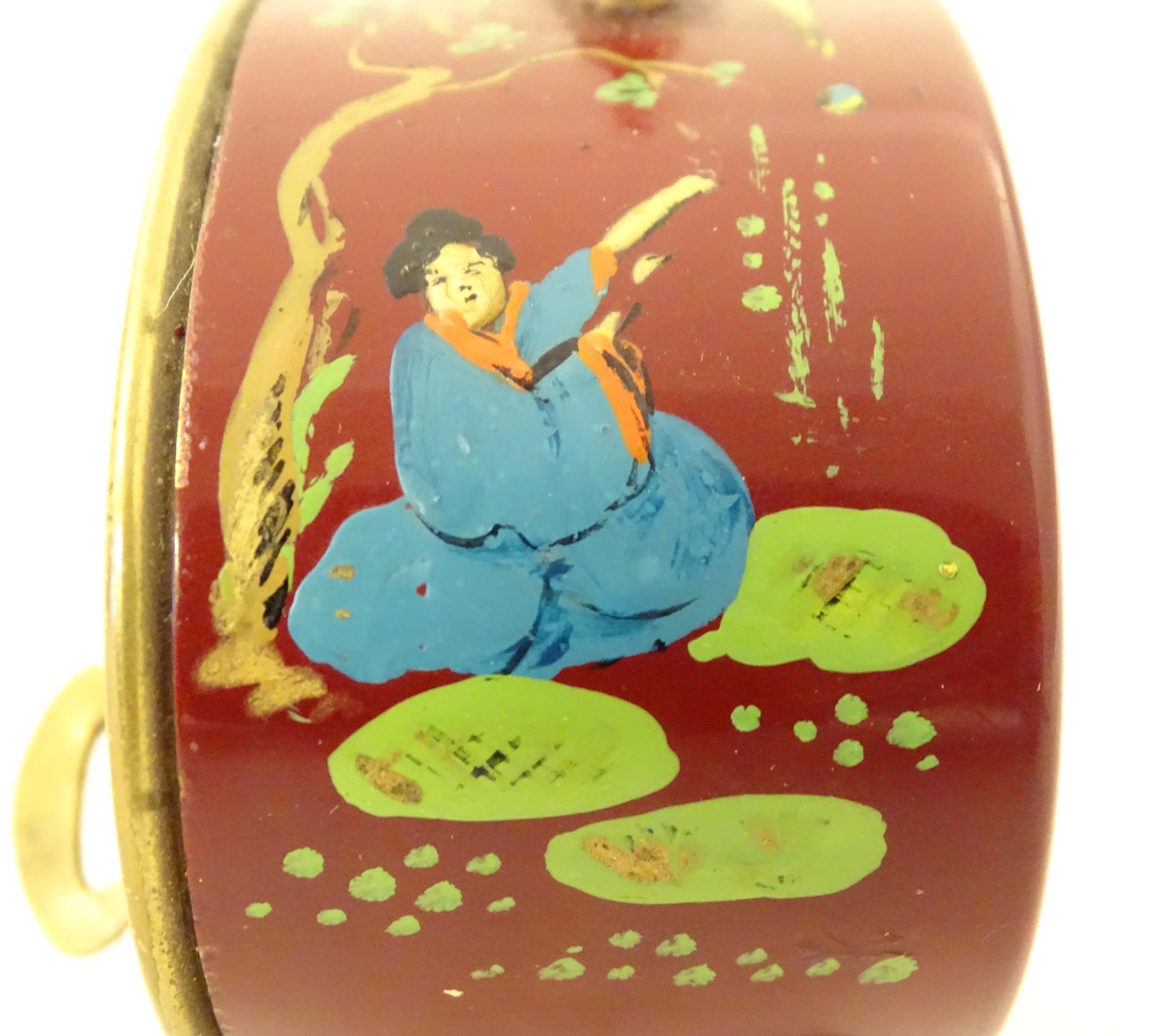 A 20thC French red lacquered travelling alarm clock with chinoiserie decoration. The dial signed - Image 9 of 12