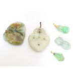 Assorted Oriental carved jade and hardstone pendants. Largest approx. 2" long (5) Please Note - we