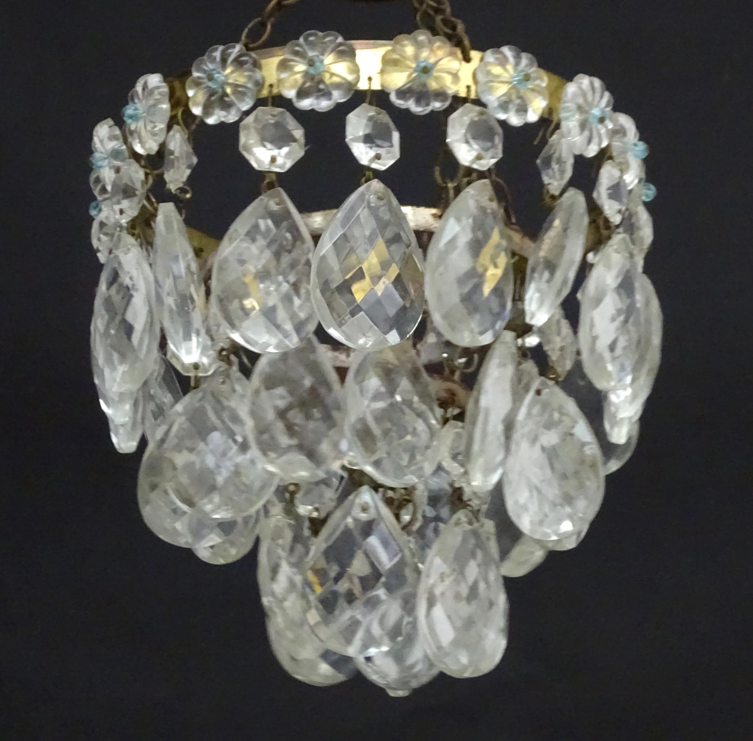 An early 20thC crystal drop bag pendant chandelier, the circular gilt metal mounts supporting - Image 5 of 5