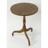 A mahogany 19thC tripod table with a circular reeded top above a turned pedestal base and legs