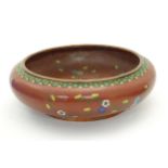 A Chinese cloisonne shallow bowl with floral and foliate detail. Approx. 3 1/4" x 10" diameter