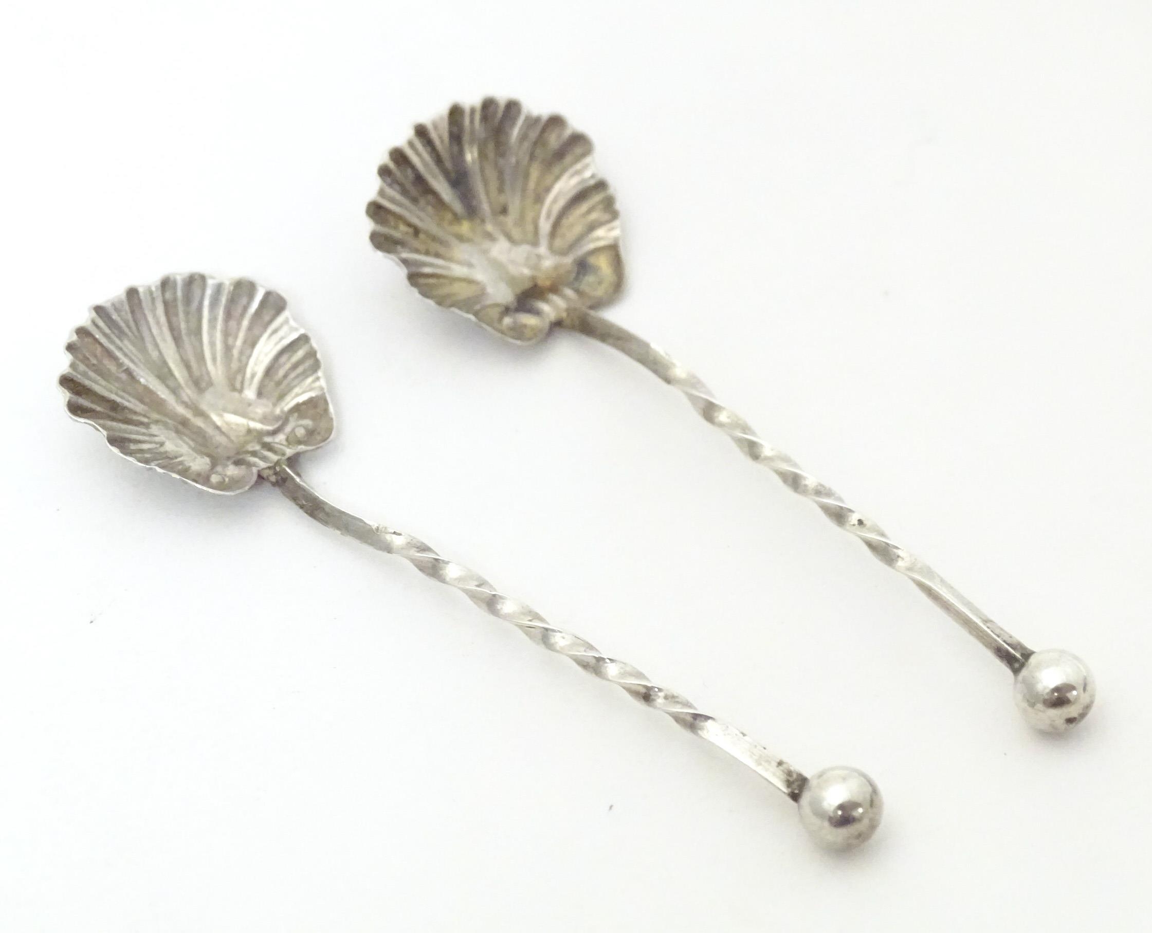 Two silver salt spoons with shell formed bowls, hallmarked Chester 1902 maker William Henry Leather.