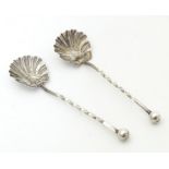 Two silver salt spoons with shell formed bowls, hallmarked Chester 1902 maker William Henry Leather.
