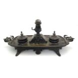 A 19thC Continental bronze desk standish with twin handles modelled with swan heads, the central