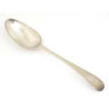 A 19thC silver feather edge tablespoon, hallmarked London 1780 maker John Lambe. Approx 8 1/2"