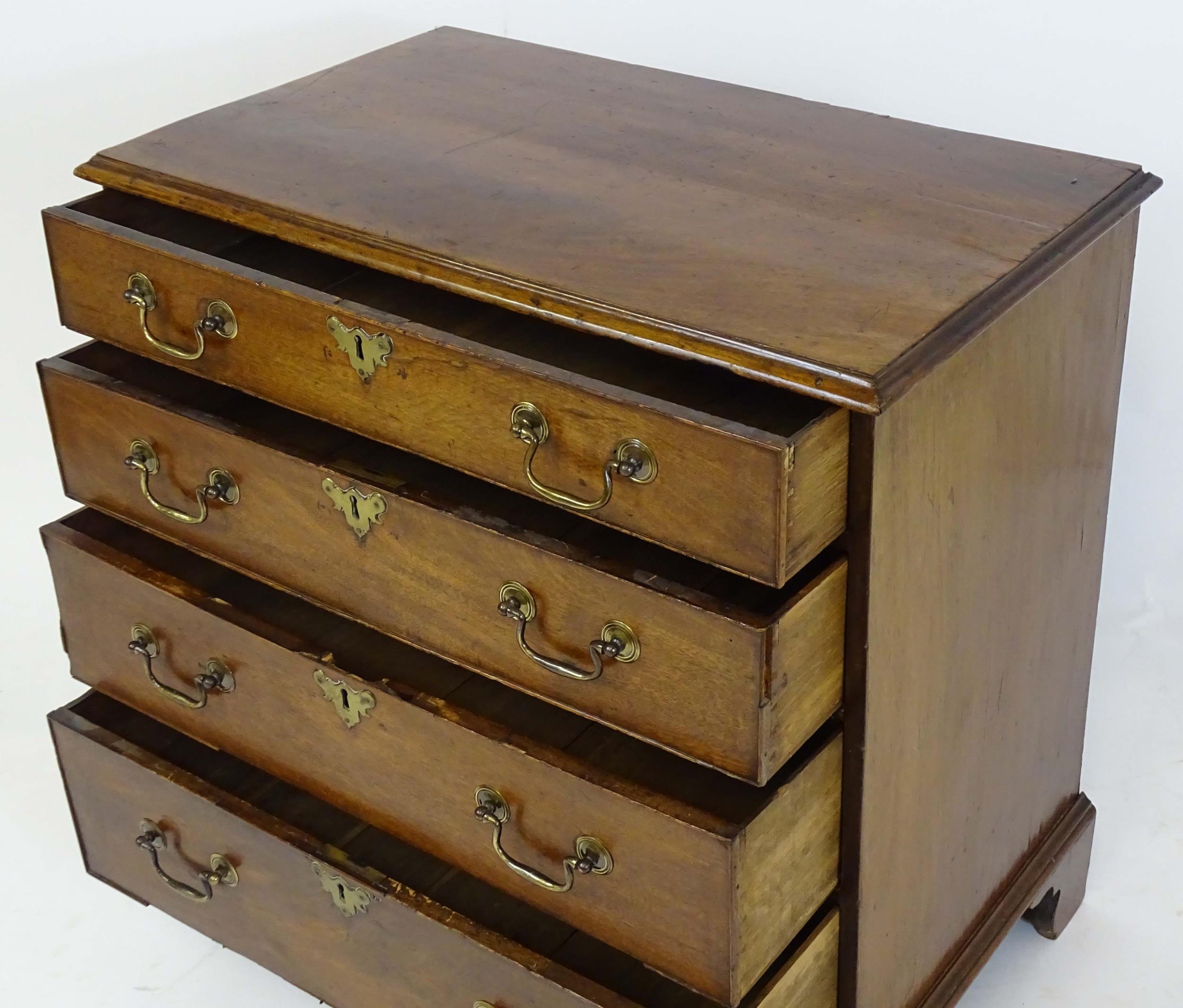 A Georgian mahogany chest of drawers with a moulded top above four long drawers with swan neck - Image 6 of 6