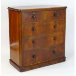 A large Victorian mahogany chest of drawers with a moulded top above two short over three long