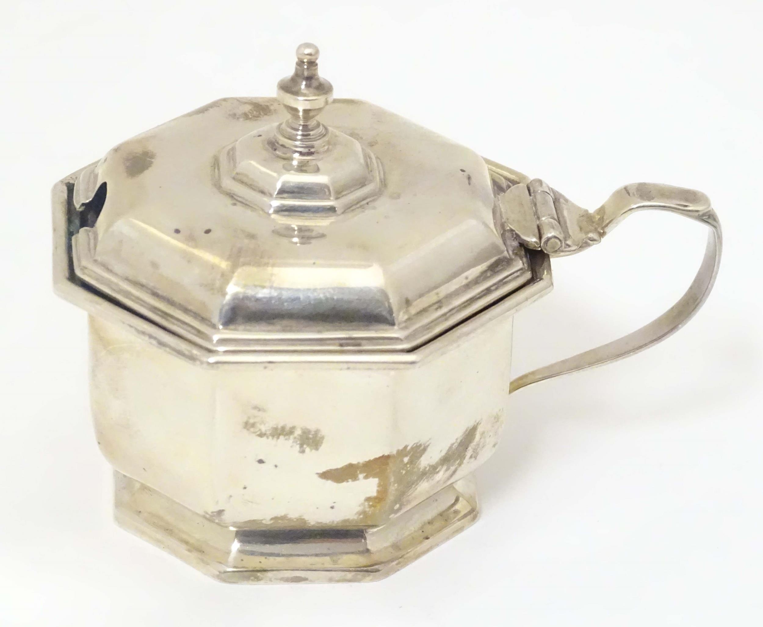 A silver mustard pot of octagonal form with blue glass liner. Hallmarked Birmingham 1933, maker - Image 4 of 7