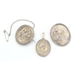 Two white metal brooches of oval form set with various classical scenes together with a white
